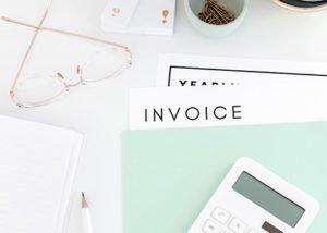 Flatlay with invoice and calculator